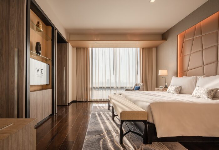 VIE Hotel Bangkok bedroom. Luxury gay-friendly hotel room with king bed, modern design, and city view. Top choice for gay hotels in Bangkok.