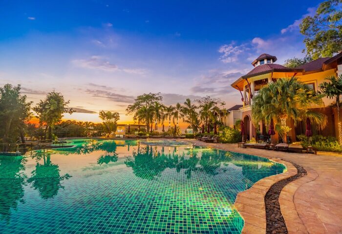 InterContinental Pattaya Resort pool at sunset. Top romantic gay beachfront hotel in Pattaya, Thailand. IHG Hotel.