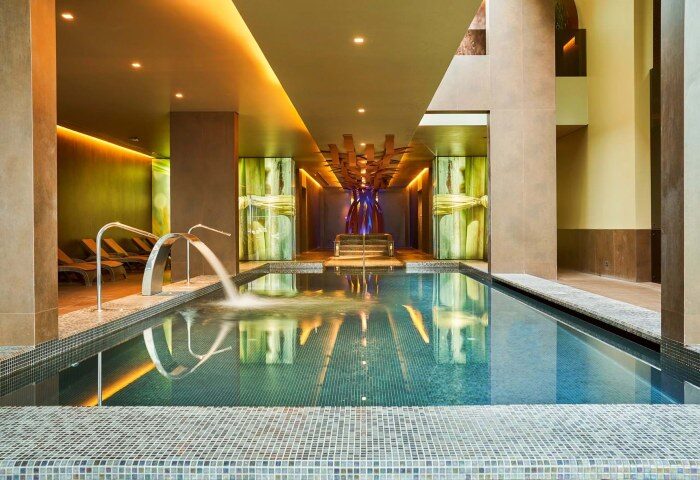 Saccharum Madeira Portugal: Top spa beach resort gay hotel in Madeira. Indoor pool with water feature at the Saccharum Hotel, perfect for gay travel.