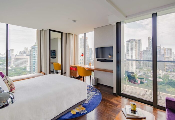 Hotel Indigo Bangkok Wireless Road room. Trendy, funky gay hotel with city view. Modern design, desk, balcony. Top Bangkok hotels for gay travelers.