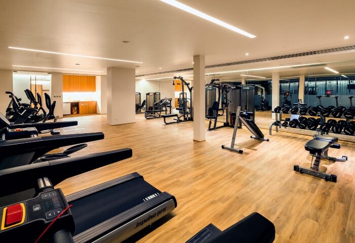 Explorar Koh Samui Adults Only Resort gym. Fitness center with treadmills, weights, and machines. Gay-friendly beachfront hotel wellness.