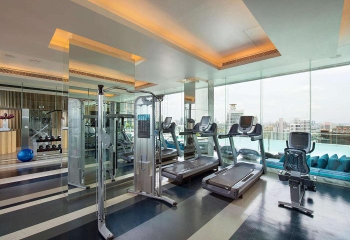 Hilton Sukhumvit Bangkok wellness center. Treadmills, weights, and skyline views. Top gay hotels in Bangkok for wellness and fitness.