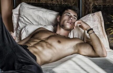 Touch Of London Gay Massage Spa: Muscular man lying on a bed. Gay travel advice, massage and spa for gay men in London.