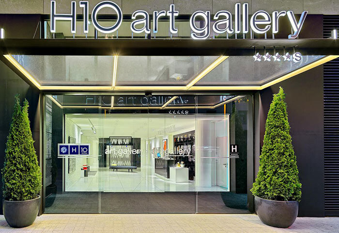 H10 Art Gallery Hotel entrance, a top-rated gay hotel in Barcelona's Eixample. Modern design, five-star rating. Ideal for gay travel in Barcelona.