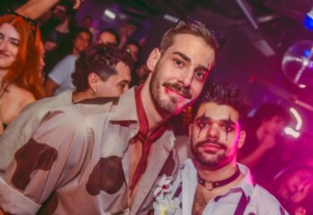 Gay men in Lisbon party. Trumps Lisbon: Two men in costume at a gay club. Nightlife, travel, and queer scene in Portugal.