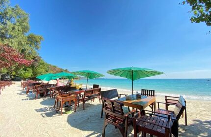 Tubtim Resort Koh Samet: Beachside dining with umbrellas. Best gay beach vibe in Thailand. Tropical travel destination.