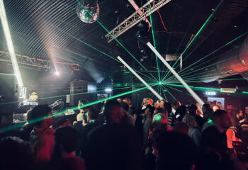 UNION Club Vauxhall: Late-night gay dance club in London. Crowd enjoying the music under disco ball and laser lights. Gay nightlife.