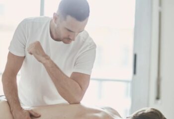 Under Pressure Massage, Barcelona. Gay massage therapist giving a deep tissue massage. Relaxation and wellness for gay men travelers.