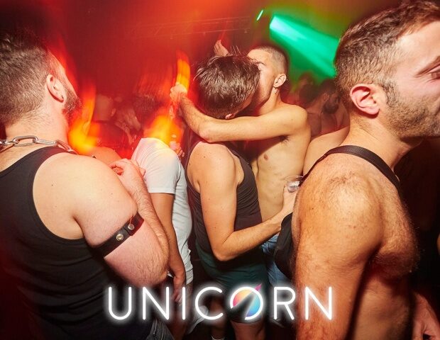 Gay men dancing at UNION Club, London. The Unicorn gay dance event in London features a dark sex room. Nightlife at its best.