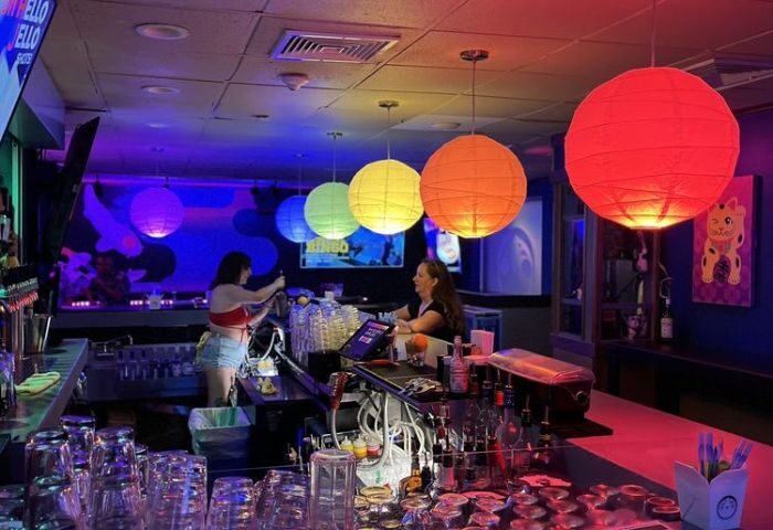 Wang Chung's Karaoke Bar in Honolulu. Bartenders, drinks, & colorful lanterns. A popular gay bar for karaoke & drag shows.