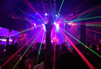 Zag Club Patong, Phuket: Best gay bar and dance club. Crowd dancing under laser lights. Nightlife for gay men in Thailand.