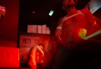 Entre Deux Eaux Paris: Gay sauna scene with two nude men in a red lit room. Gay travel advice for saunas in Paris.