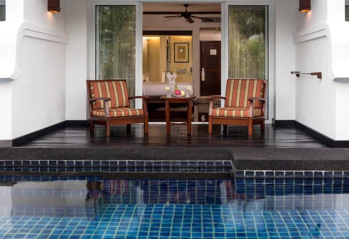 JW Marriott Khao Lak Deluxe room's patio. Chairs, table, and pool access. Luxury gay travel in Thailand. hktkl-deluxe-0150.jpg