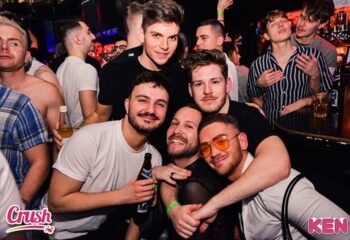 KEN Club Vienna: Group of gay men smiling and posing at the KEN Club. Nightlife scene, gay travel advice, Vienna's gay scene.