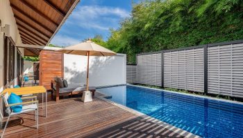 SAii Koh Samui Villas room-0007. Private pool with wooden deck, sunbed, and umbrella. Lush greenery. Ideal gay travel getaway.