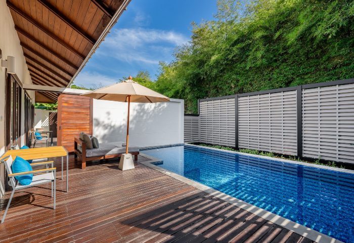 SAii Koh Samui Villas room-0007. Private pool with wooden deck, sunbed, and umbrella. Lush greenery. Ideal gay travel getaway.