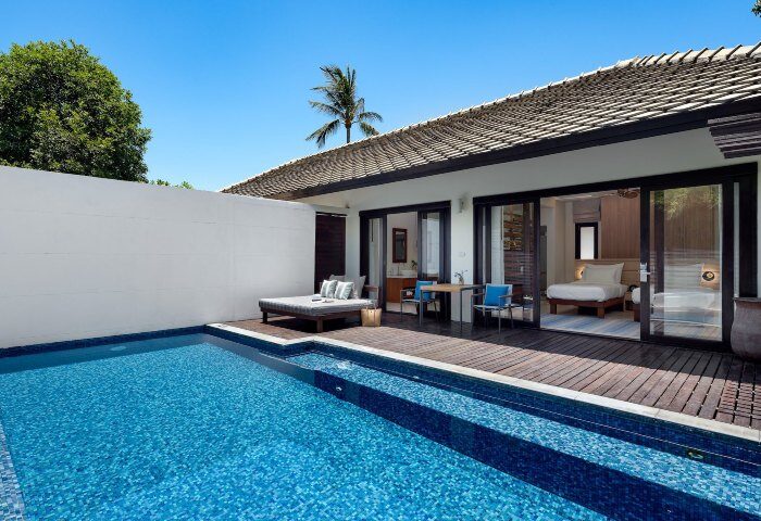 SAii Koh Samui Villa room-0021: Private pool and deck with daybed at luxury gay-friendly resort. Bedroom view from poolside. Tropical getaway.