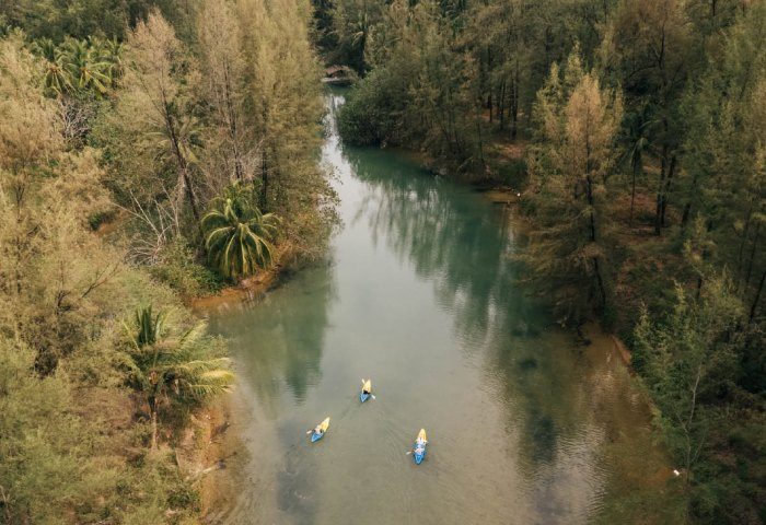Devasom Khao Lak Beach Resort: Kayaking on river surrounded by trees. Gay travel adventure at Khao Lak villas. website-gallery-25.jpg